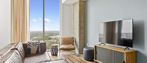 Luxury Condo, 1 King Bed with Sofa bed, Balcony, City View | Living area | LED TV, Netflix, books, streaming services