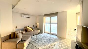Panoramic Apartment | Living area | 50-inch LED TV with digital channels