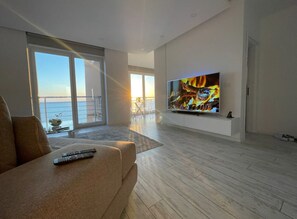 Panoramic Apartment | Living area | 50-inch LED TV with digital channels