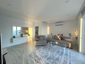 Panoramic Apartment | Living area | 50-inch LED TV with digital channels