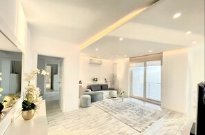 Panoramic Apartment | Living area | 50-inch LED TV with digital channels