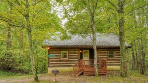 A rustic cabin with a wooden deck and a mailbox. - Chickasaw in Hocking Hills (Logan)