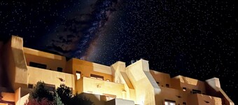 Queen adobe studio with full kitchen, in-unit washer/dryer & fireplace. Private balcony + valley views. 15 min to Taos Ski Valley · 5 to Arroyo Seco. Sleeps 2.
