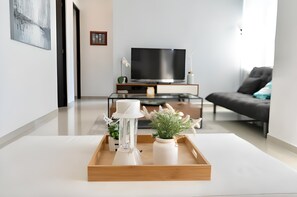 Family Apartment | Living area | 32-inch flat-screen TV with digital channels
