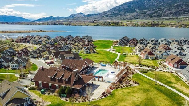 A residential area with houses, a swimming pool, and a lake. - Location Cottage - close to pools! 111 (Osoyoos)