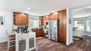 Fridge, microwave, cookware/dishes/utensils, dining tables