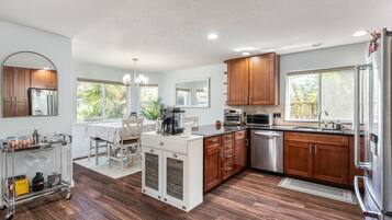 Fridge, microwave, cookware/dishes/utensils, dining tables