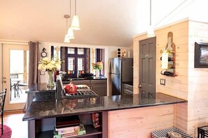 Fridge, microwave, oven, stovetop - Charming 2BR home with peaceful views, steps from downtown Highlands. (Highlands)