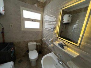 Shower, hair dryer, towels, soap
