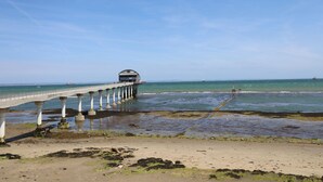 A pier extending into the sea with a covered viewing area at the end. - Bay View (Bembridge)