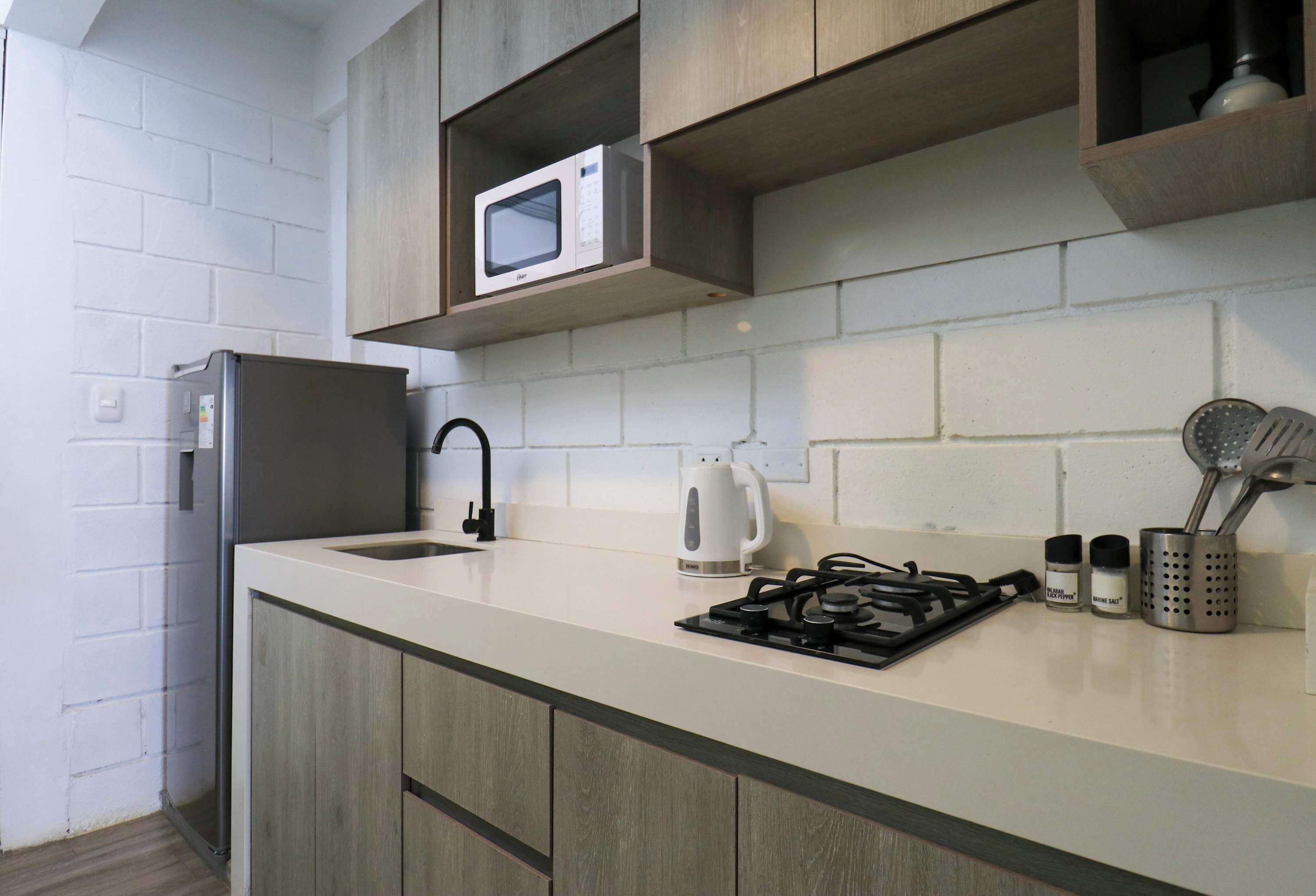 Fridge, microwave, stovetop, coffee/tea maker