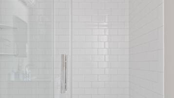 Shower, hair dryer, towels, shampoo