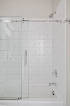 Shower, hair dryer, towels, shampoo