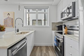 Fridge, microwave, oven, stovetop - Idyllic Corner Unit 1BDRM in Seton - Sleeps 4 (Calgary)