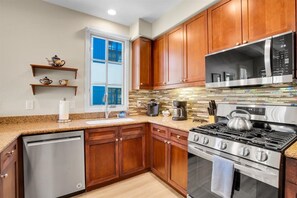 Coffee/tea maker, fridge, microwave, oven