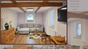 Un salon avec un canapé, des meubles en bois, une télévision et une fenêtre.
