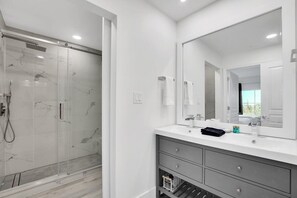 Shower, hair dryer, towels
