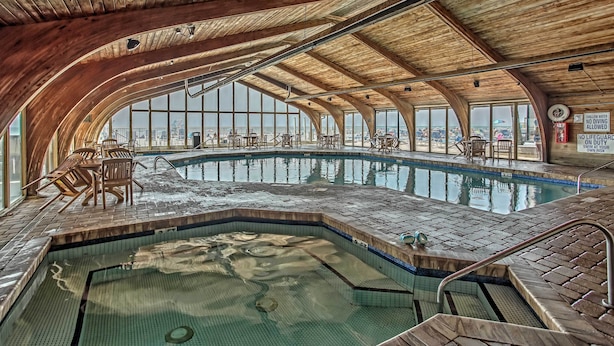 A large indoor swimming pool with a wooden ceiling and large windows. - Oceanfront Gem w/ Community Perks in Myrtle Beach (Myrtle Beach)