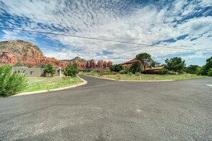 A road leading to a building with a mountain backdrop. - Pet-friendly Sedona Home: Hot Tub, Walk to Trails! (Sedona)