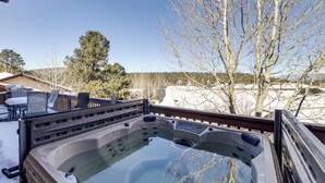 A hot tub on a deck with a clear view of trees and a snowy landscape. - Angel Fire Townhome w/ Hot Tub: 2 Mi to Ski Resort (Angel Fire)