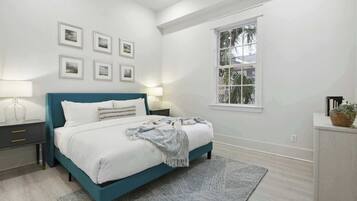 1 bedroom, desk, iron/ironing board, travel crib