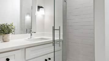 Shower, hair dryer, towels, shampoo