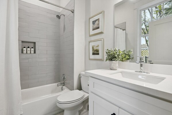 Shower, hair dryer, towels, shampoo