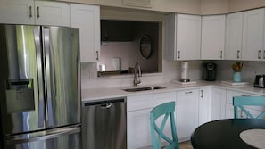 Fridge, coffee/tea maker, cookware/dishes/utensils