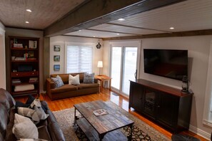 TV, fireplace, books, stereo