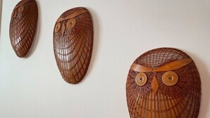 Three wooden wall art pieces with owl designs. - Relax in Style & Comfort in South Bay, PEC (Prince Edward)