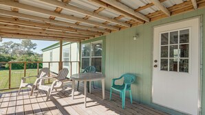 A covered porch with wooden beams, a table, and chairs. - 4 Mi to State Park: Peaceful Rockport Home w/ Yard (Rockport)