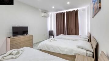 1 bedroom, desk, iron/ironing board, travel cot