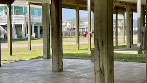 A covered outdoor area with concrete flooring and wooden pillars. - Family fun! Perfect for families to make memories (Freeport)