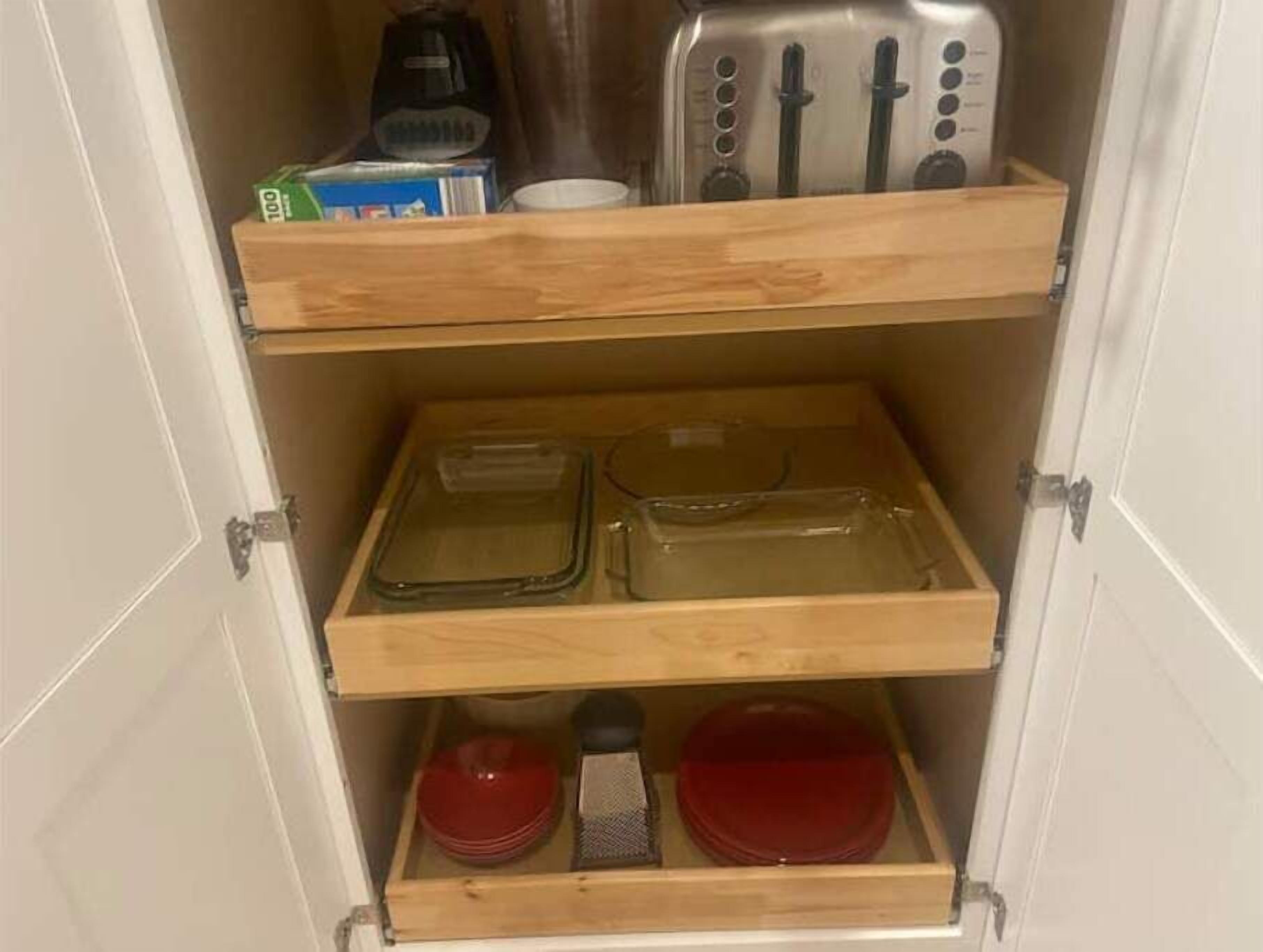 A kitchen with wooden shelves, a toaster, and a coffee maker.