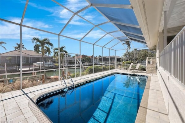 Outdoor pool, a heated pool - Sunny Southern Exposure Home Rental on Canal! Great Reviews! (Marco Island)