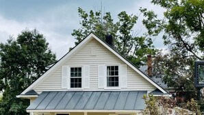 A white two-story house with a porch and a chimney. - Cozy Country Getaway in the Heart of Upperville  (Upperville)