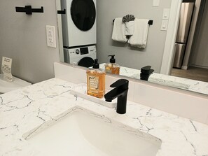 Hair dryer, towels, soap, shampoo