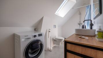 Shower, hair dryer, towels