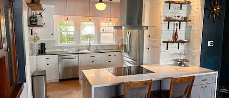 Coffee/tea maker, fridge, microwave, oven