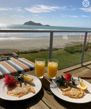 Outdoor dining - Ultimate Beachfront - Family Friendly with games room and multiple decks (Waimarama)