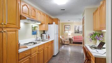 Fridge, microwave, stovetop, coffee/tea maker