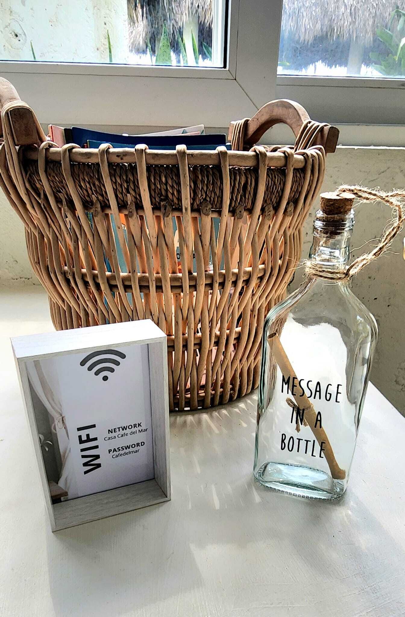A wicker basket, a WiFi sign, and a bottle labeled "MESSAGE IN A BOTTLE".