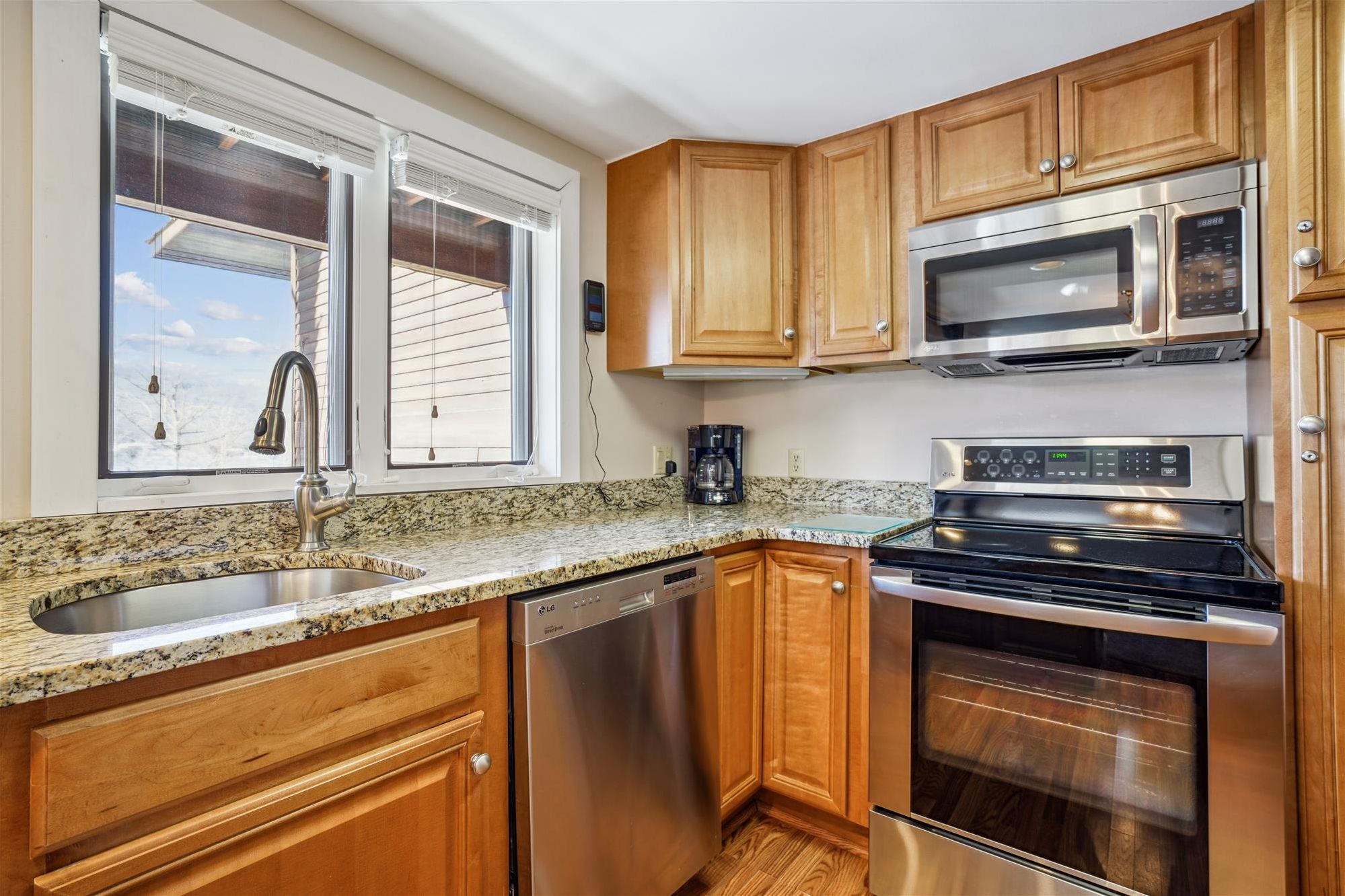 Updated Kitchen with Granite Counters - Well-equipped kitchen featuring stainless appliances, granite countertops, and plenty of prep space.