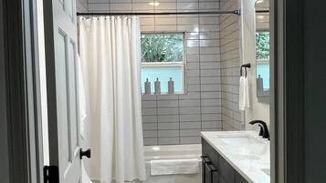 Shower, hair dryer, towels, soap