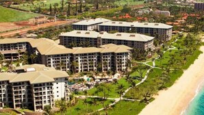 A resort with multiple buildings, a beachfront, and a clear view of the ocean. - Ocean Front Westin Villas North!  Gorgeous Pools, Beach & Amenities! (Lahaina)