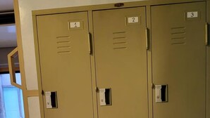 A set of six beige metal lockers with numbered labels from 1 to 6, arranged in two columns. - Terminal 58 hostel at town (Phuket)