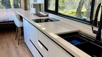 Fridge, stovetop, coffee/tea maker, cookware/dishes/utensils