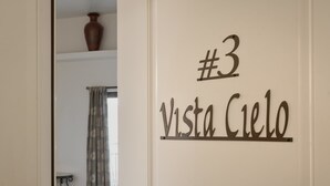 A wall with a sign reading "#3 Vista Cielo".