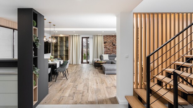 A modern interior with a kitchen, dining area, and living space.