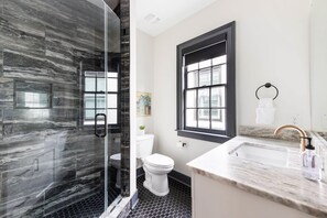 Shower, hair dryer, towels, shampoo